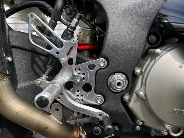 Sato Racing Rear Sets in Silver on an RC51